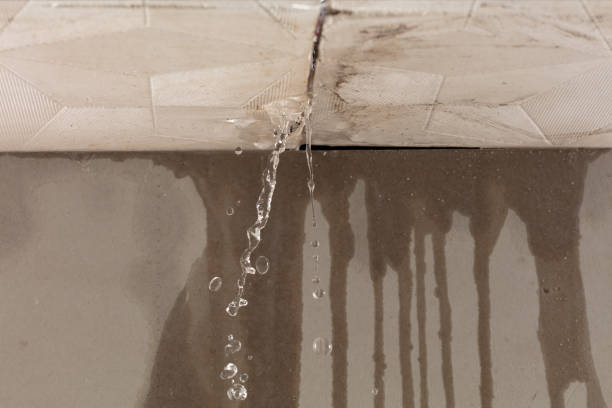 Professional Flood Damage Cleanup technician working in Rowe, MA